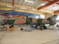 MiG-21

"A baráti NDK Nemzeti Néphadseregének korszerű elfogóvadász repülőgépe"
El Pasoban és Kanadában sok német pilóta állomásozik, ott gyakorlatoznak. Az Észak-Amerikában állomásozó Luftwaffe-egységek parancsnoka ajándékozta a gépet a múzeumnak. 
